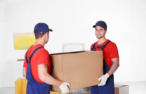 Removal van loading recyclable moving boxes in Shepherd’s Bush