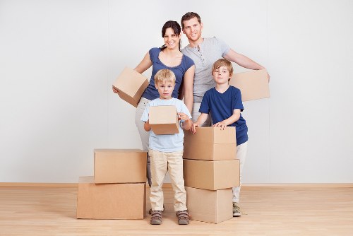 Packed boxes and furniture prepared for a flat removal in Shepherds Bush