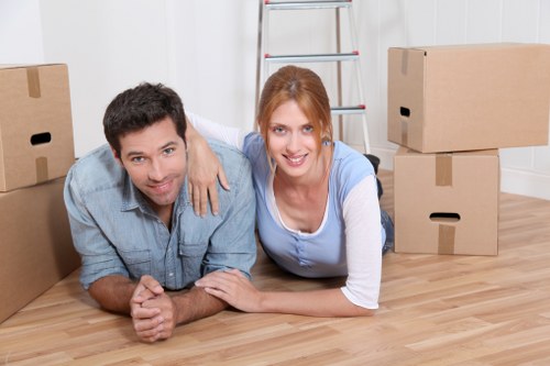 Professional movers handling boxes and furniture carefully