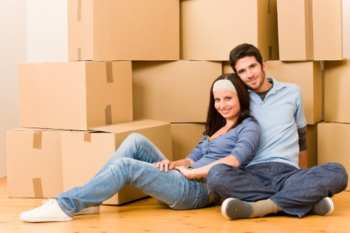 Trained movers handling furniture with care during relocation