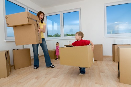 Boxes and furniture being unloaded at a Shepherds Bush home