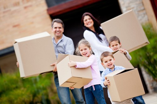 Careful loading of protected household items into a removal van