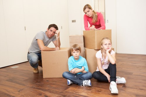 Moving team handling packed boxes during transport