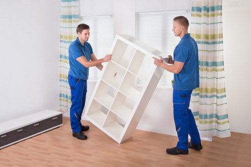 A local removals team navigating narrow access in a Shepherds Bush property