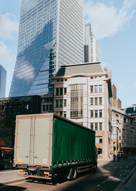 A red double-decker bus with a digital route display showing 'Hayes By-Pass' is in the process of arriving or departing from a parking area outside Westfield shopping centre in Shepherds Bush, London.